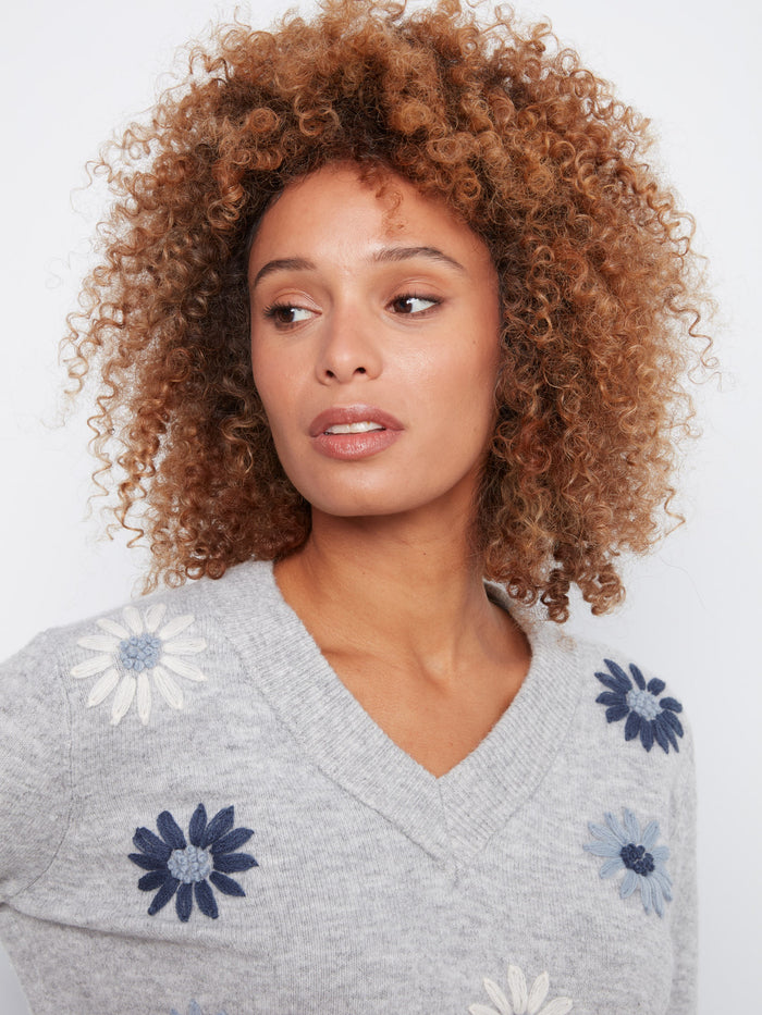 Stylish heather-grey knit with beautiful floral accents and ribbed cuffs by Charlie B.