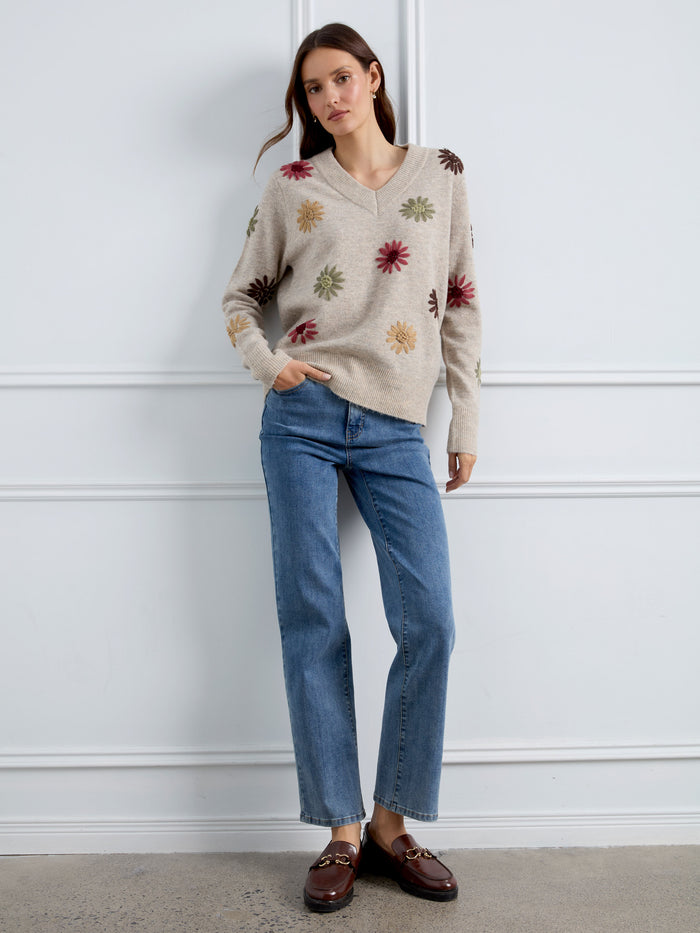 A beautifully embroidered piece with long sleeves that adds sophistication to your ensemble. Crafted by Charlie B.