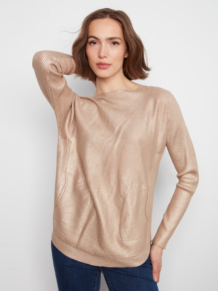 Chic top featuring a boat neck design, perfect for casual outings. Styled with front pockets for added convenience by Charlie B.