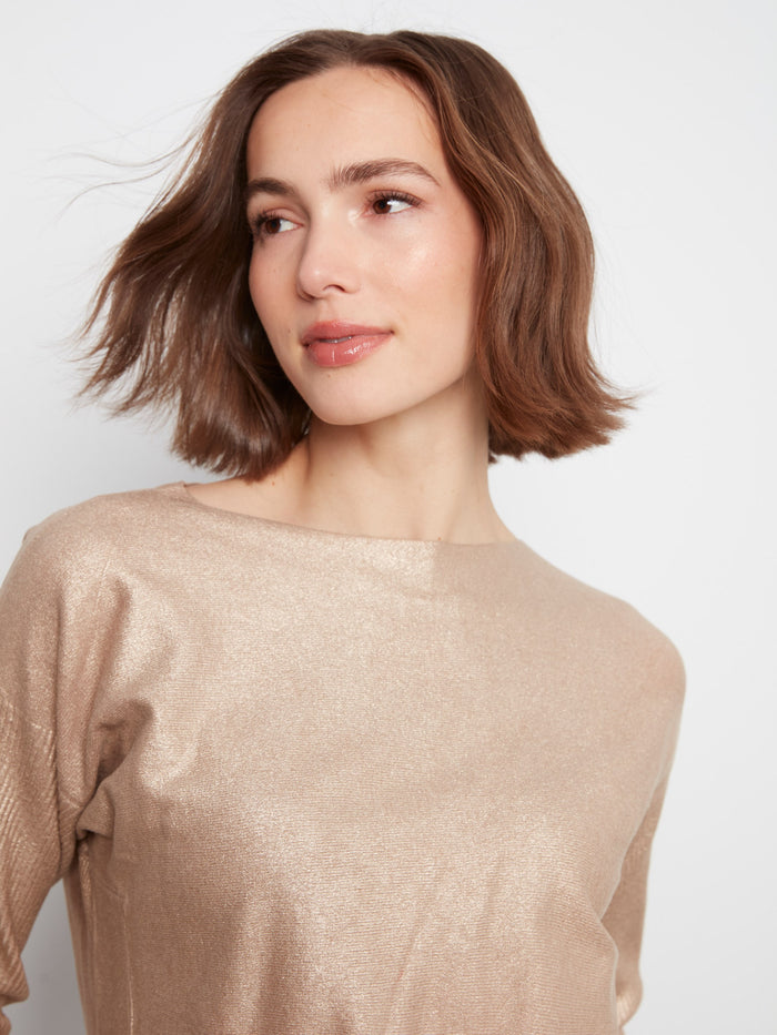 Elegant top with a metallic finish that adds a touch of glamour to any outfit. Designed with a rounded hem by Charlie B.