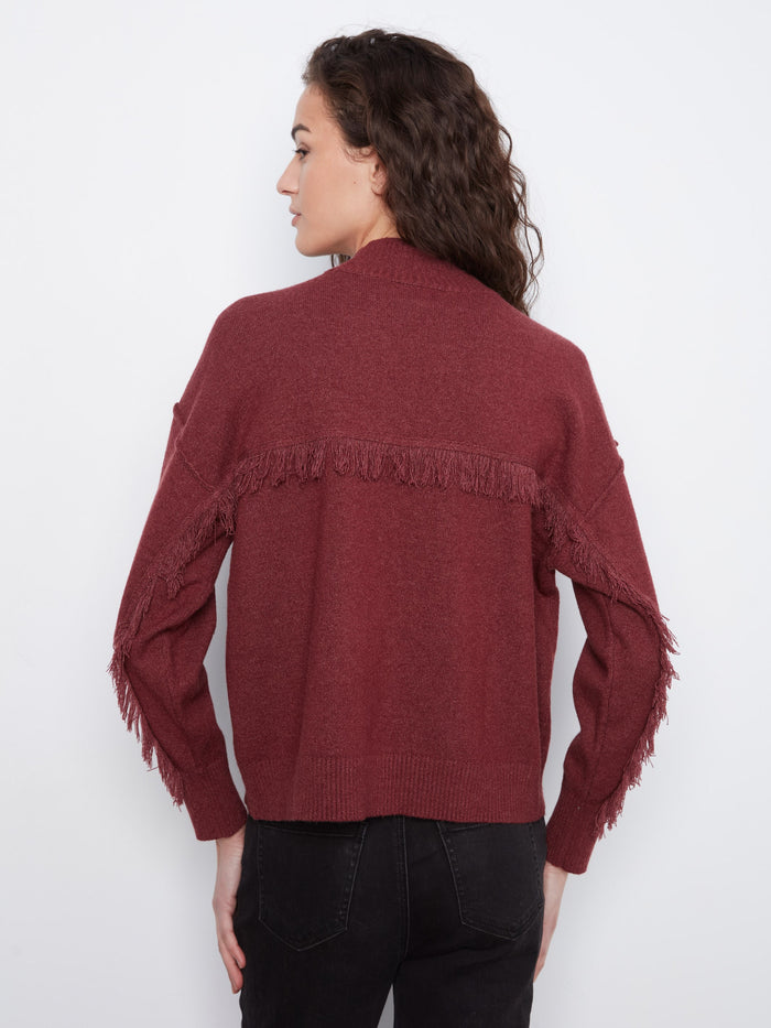 Heather-Merlot sweater with intricate fringe detail across the back, offering both style and warmth for cooler days by Charlie B.