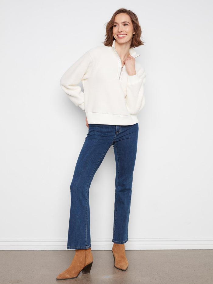 Relaxed fit sweater featuring ribbed cuffs and hem, perfect for casual outings or lounging by Charlie B.