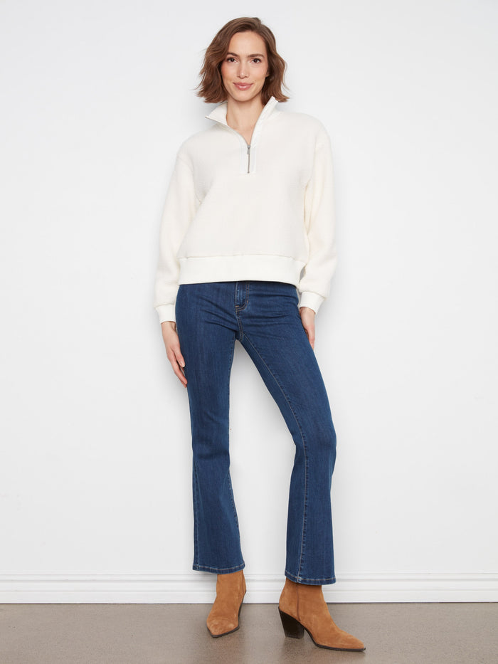 Soft fleece fabric enhances the cozy feel of this versatile relaxed fit sweater with stand collar by Charlie B.