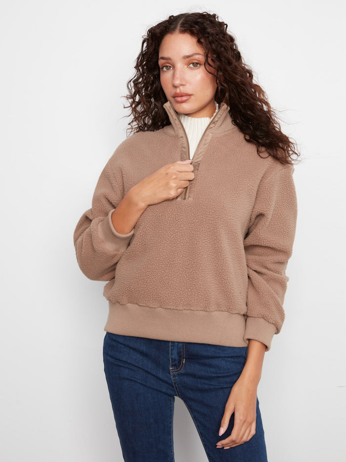 Taupe fleece pullover featuring a relaxed fit and ribbed hem, perfect for cozy days by Charlie B.