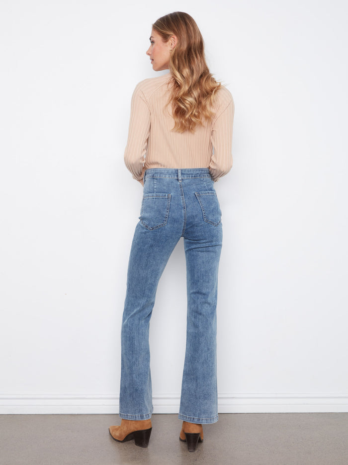 Full-length denim jeans with a regular rise, offering classic style and versatile wearability for any occasion. By Charlie B.