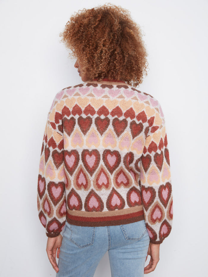 A classic mock neck elevates this heart-patterned sweater into an elegant choice for cooler days by Charlie B.