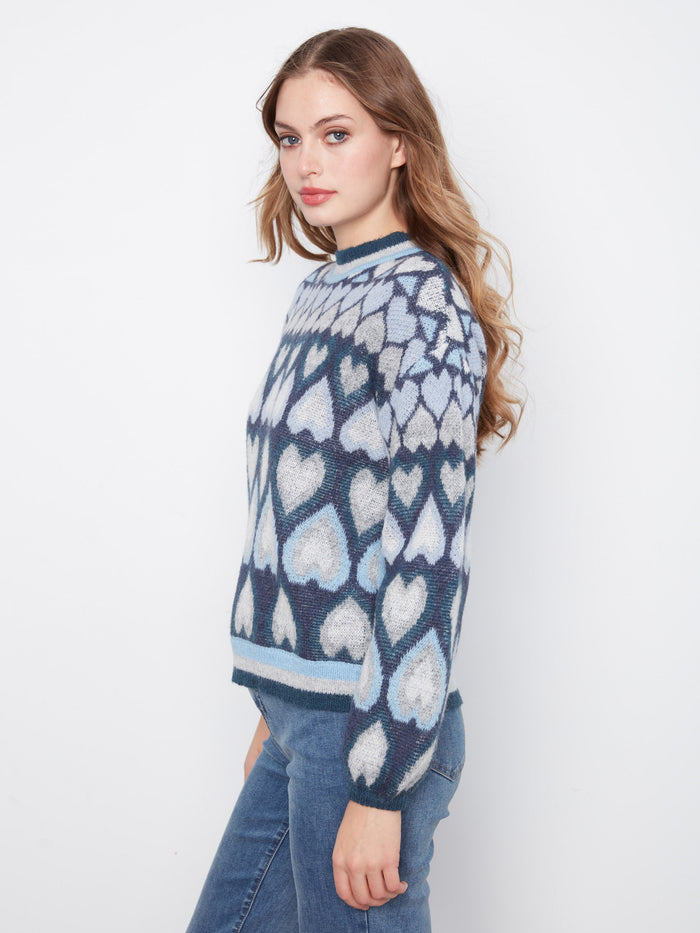 Sophisticated navy sweater with a unique jacquard heart motif and comfortable fit by Charlie B.