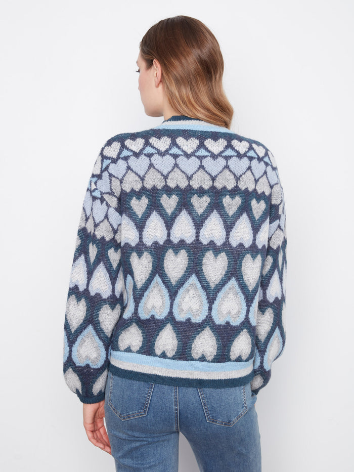 Navy sweater crafted with love, featuring an intricate heart pattern and modern mock neck style by Charlie B.