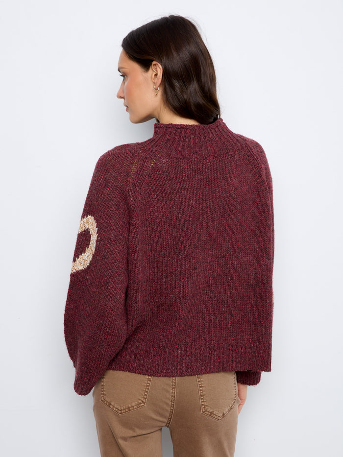 Warm and inviting knit featuring a relaxed fit adorned with hearts to keep you stylishly comfortable all day long. By Charlie B.