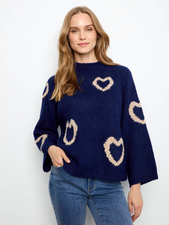 Navy sweater with mock neck and heart patterns, featuring 3/4 bell sleeves for a chic look by Charlie B.