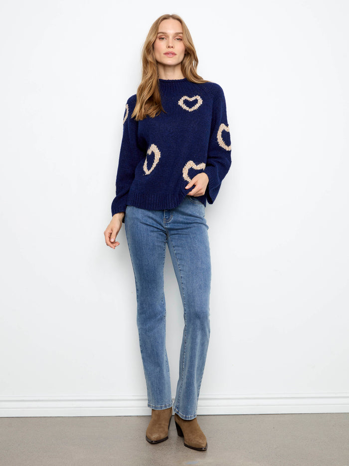 Stylish navy sweater with relaxed fit and charming heart designs, perfect for casual outings by Charlie B.
