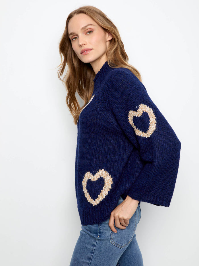 Elegant sweater in navy with mock neck and playful hearts, offering a comfortable relaxed fit by Charlie B.