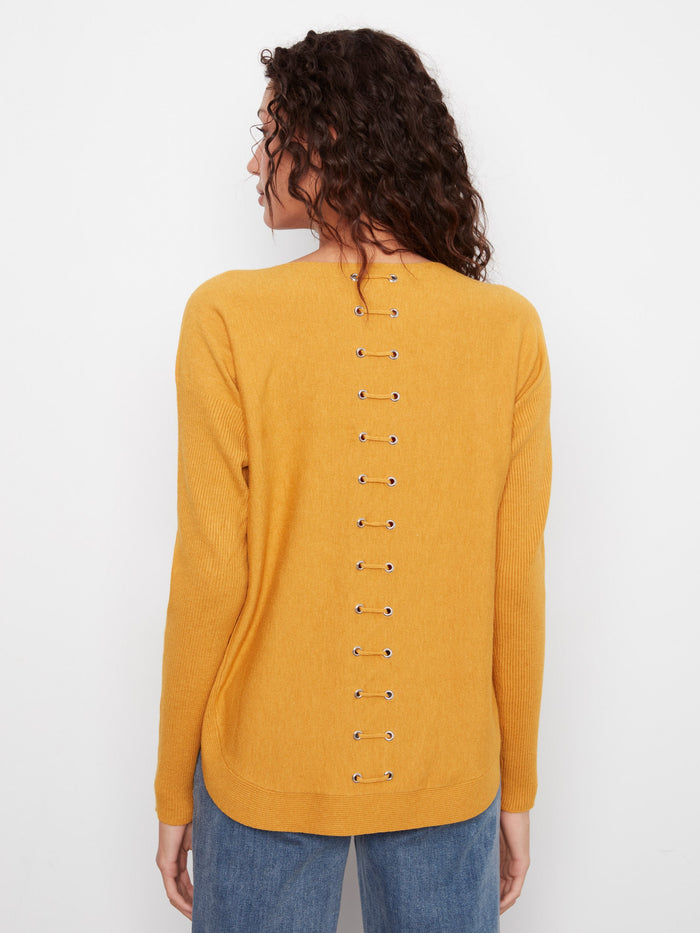 Stylish sweater with eyelets detail at the back for a unique touch. The design adds flair to your wardrobe by Charlie B.