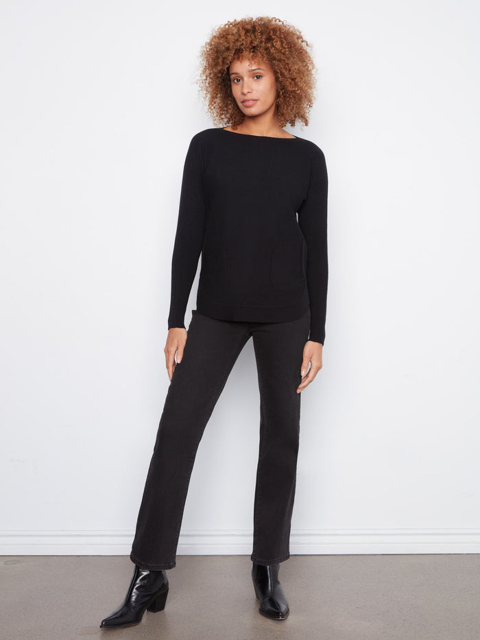 Stylish black long-sleeve sweater with functional front pockets and a flattering silhouette by Charlie B.
