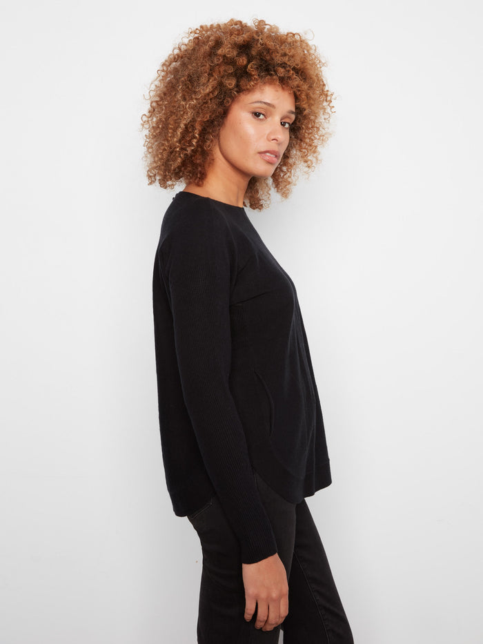 Sophisticated black knit sweater crafted with attention to detail, offering timeless elegance and comfort by Charlie B.