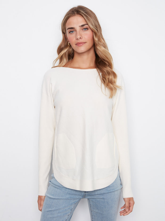 Convenient front pockets enhance the practicality of this fashionable sweater by Charlie B.