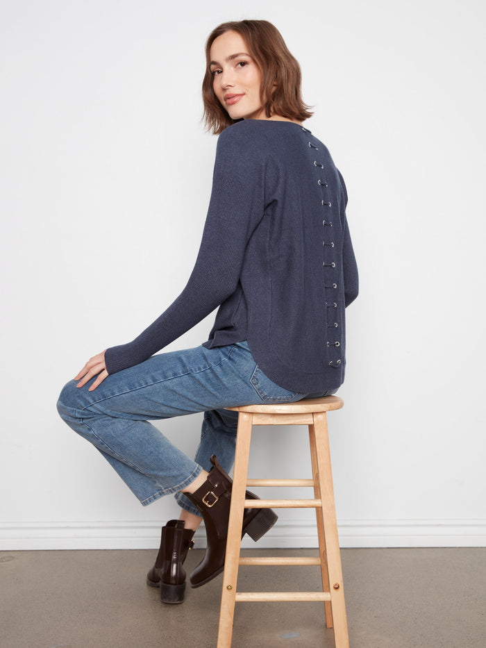 Elegant long-sleeve knit sweater with distinctive back lace-up eyelet details by Charlie B.
