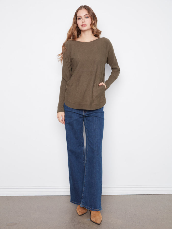 This olive sweater has back lace-up eyelet details, adding a unique twist to its classic look. A stylish choice by Charlie B.