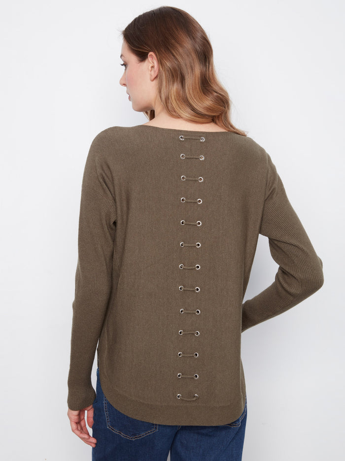 Featuring front pockets, this olive sweater combines practicality with style for everyday wear. A versatile piece by Charlie B.