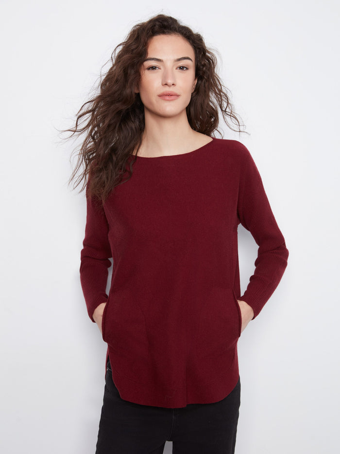 Elegant top designed with convenient front pockets, combining style and functionality by Charlie B.