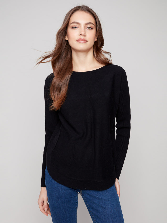 Black knit sweater featuring a stylish boat neck and long ribbed sleeves, perfect for a chic look by Charlie B.