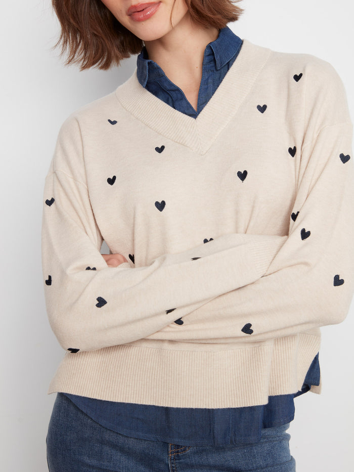 Sweater with drop shoulder design and embroidered hearts, paired with a woven collar by Charlie B.