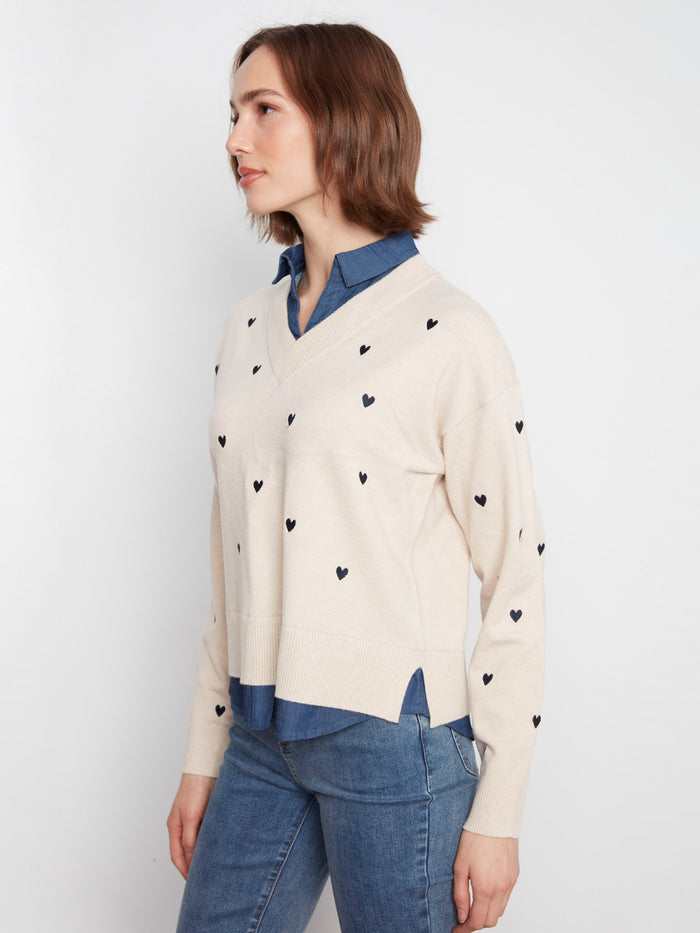 Layered shirt hem adds elegance to the Heather Oat sweater with embroidered details by Charlie B.