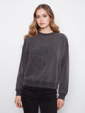 Charcoal top featuring a ribbed neck, hem and cuffs, adding texture and style by Charlie B.
