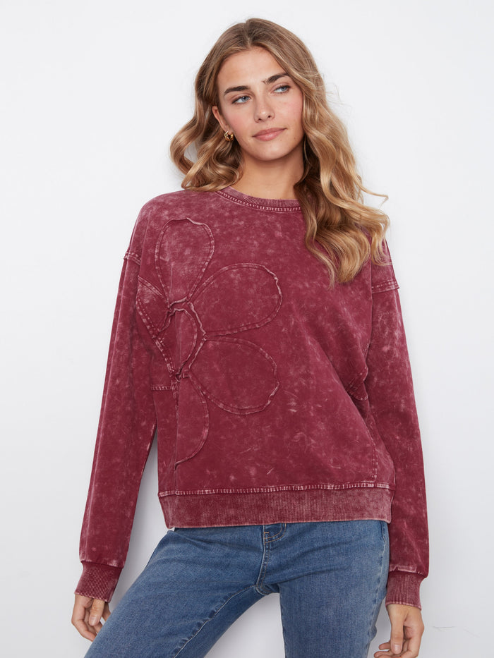 The sweater features a crew neckline that adds a classic touch to its modern design. Made with stretch cotton for comfort by Charlie B.