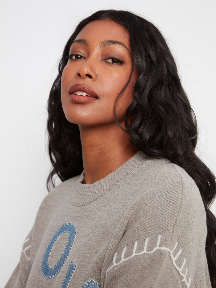 The mock neck design adds sophistication to this sweater's playful aesthetic with its unique details. Made by Charlie B.