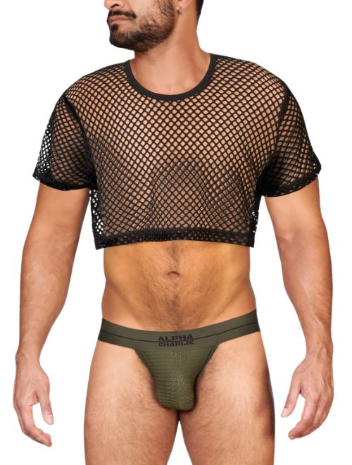 Man wearing a black fishnet crop top and green underwear on a white background
