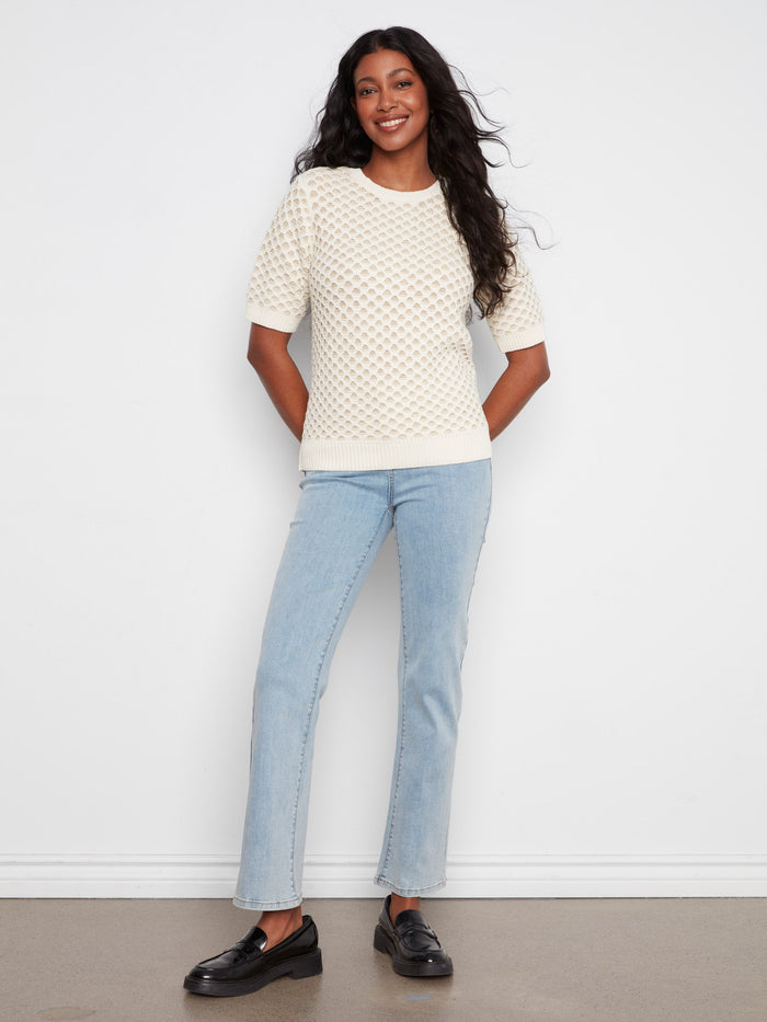 The metallic honeycomb knit pattern gives this top a unique texture and shine, making it stand out in any wardrobe by Charlie B.