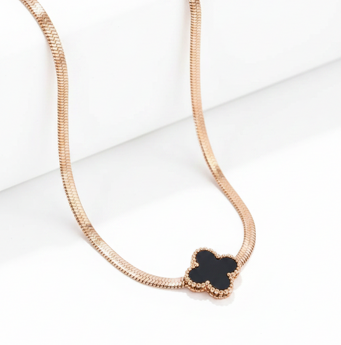 NIDA charm necklace featuring a delicate black pendant on a rose gold chain, perfect for elegant layering.