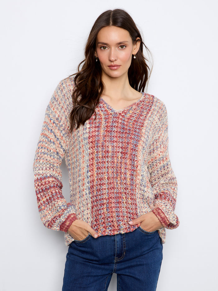 Sweater featuring a V-neckline with colorful novelty yarn, offering a unique texture and style. By Charlie B.