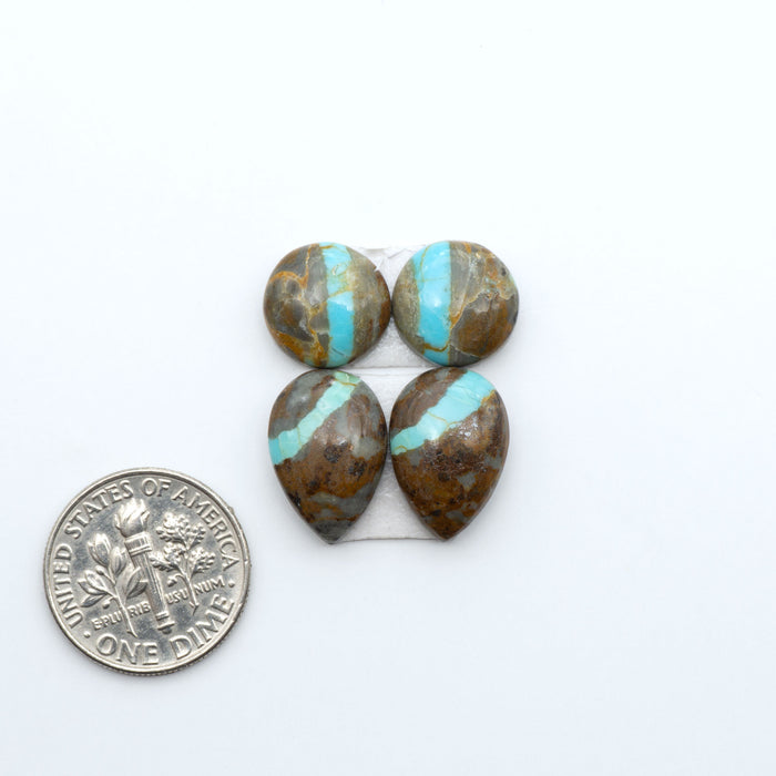 Number 8 Turquoise cabochons, blue and green color with brown matrix, polished stones on a white background, with a US dime for scale