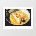 Omelette surreal art print horizontal — tanned woman in yellow bikini reclining arms spread in a large stainless steel frying pan of golden bubbling scrambled eggs on a black hob with a hand gripping the pan handle visible at top, surreal funny kitchen food print for brunch cafés and eclectic interiors