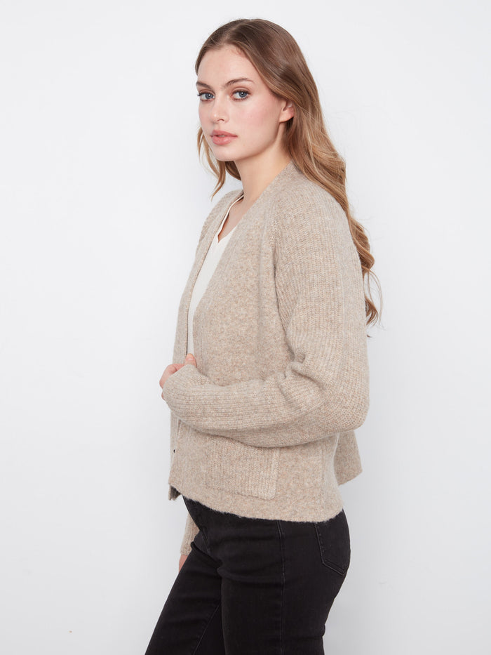 Keep essentials close with the convenient patch pockets on this elegant cardigan by Charlie B.