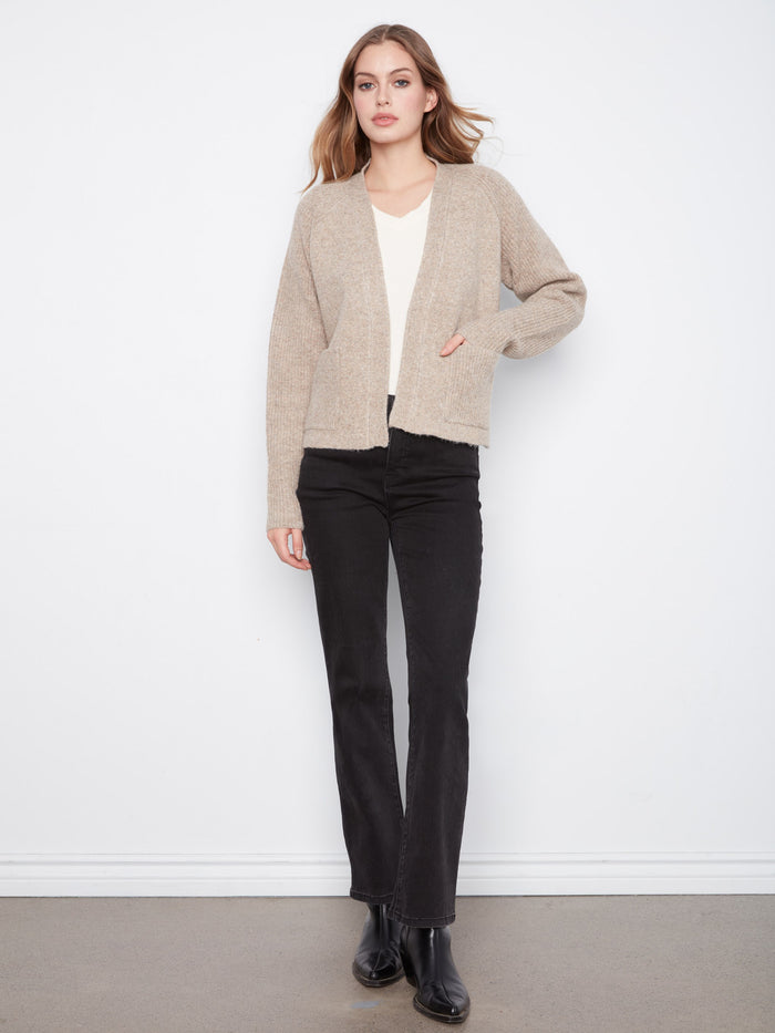 The raglan sleeves provide ease of movement and a chic silhouette in this elegant cardigan. By Charlie B.
