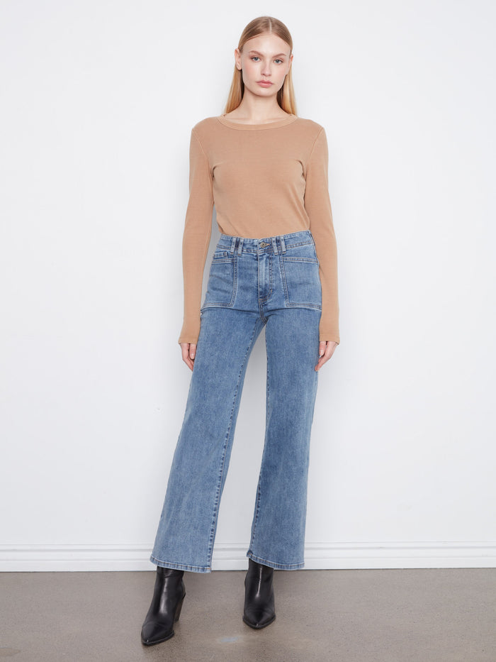 Denim jeans featuring a wide leg design, offering a stylish and comfortable fit for any occasion. By Charlie B.