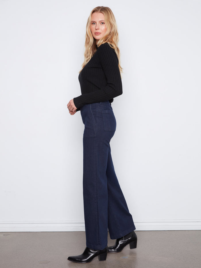 The double-button waistband adds a touch of sophistication to these chic denim pants. A fashionable creation by Charlie B.