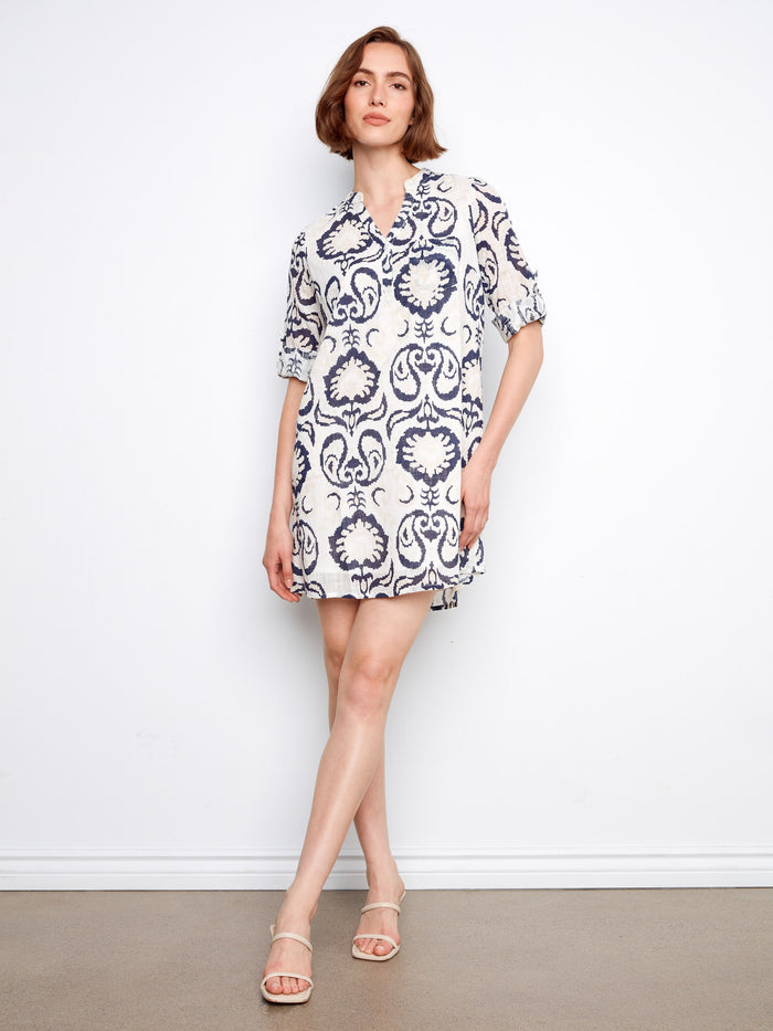 Patterned dress featuring a chest pocket, adding functionality and style to your wardrobe. Perfect for casual outings. By Charlie B.