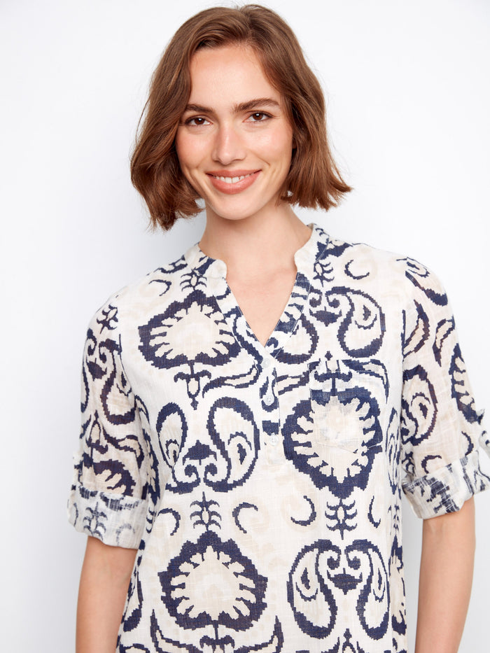 Stylish dress with a half-button design, combining comfort and fashion effortlessly in this unique pattern. By Charlie B.