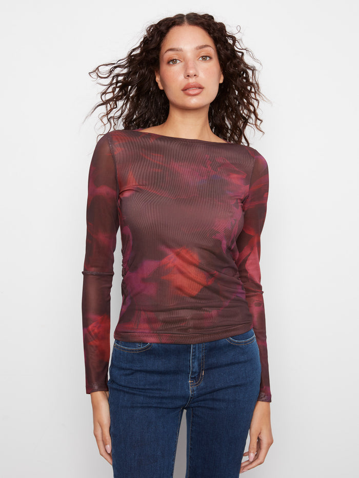 This top features a sophisticated boat neckline, perfect for a chic and elegant look by Charlie B.