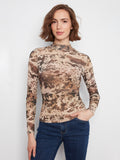 The top features a mock neckline, adding a sophisticated touch to the design by Charlie B.