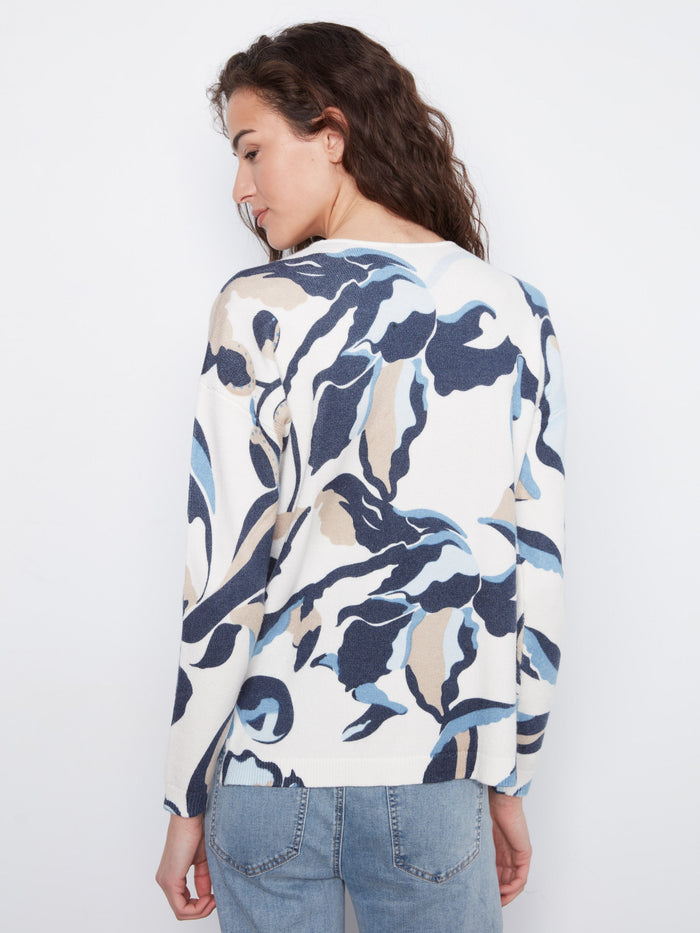 Side slits add a modern twist to this patterned sweater, providing comfort and style in one piece by Charlie B.