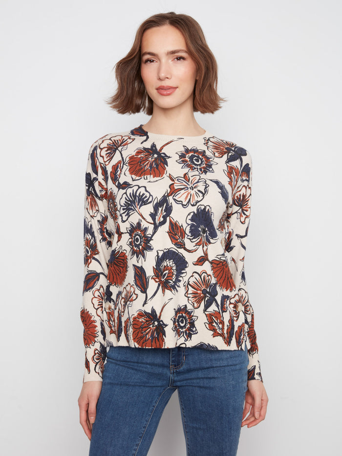 Floral sweater with a crew neck, showcasing vibrant patterns and colors that add charm to any outfit. By Charlie B.