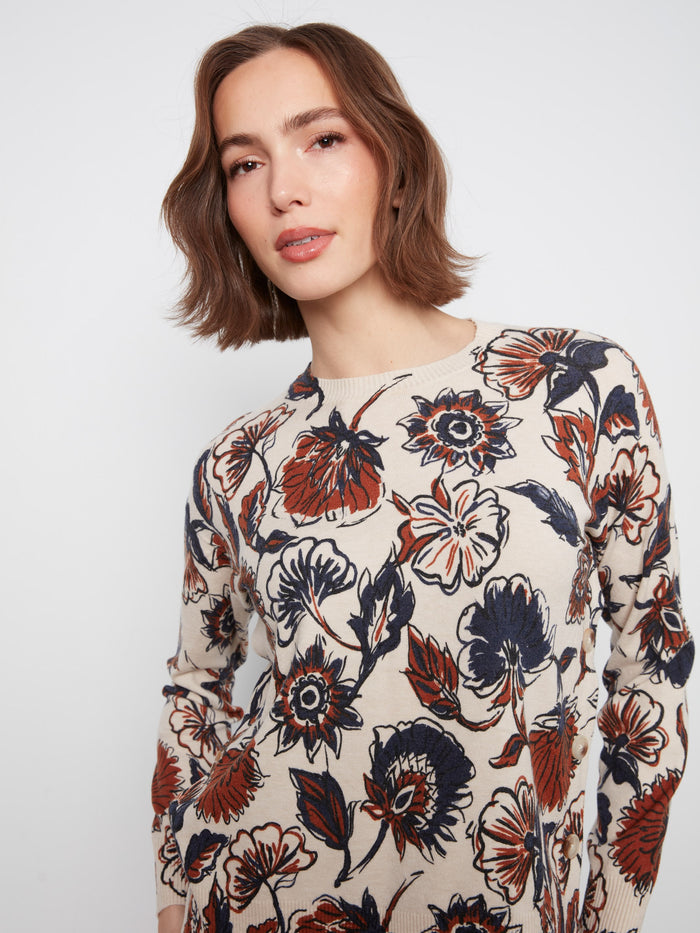 This floral sweater features a drop shoulder design, creating a relaxed and stylish look for casual days. By Charlie B.
