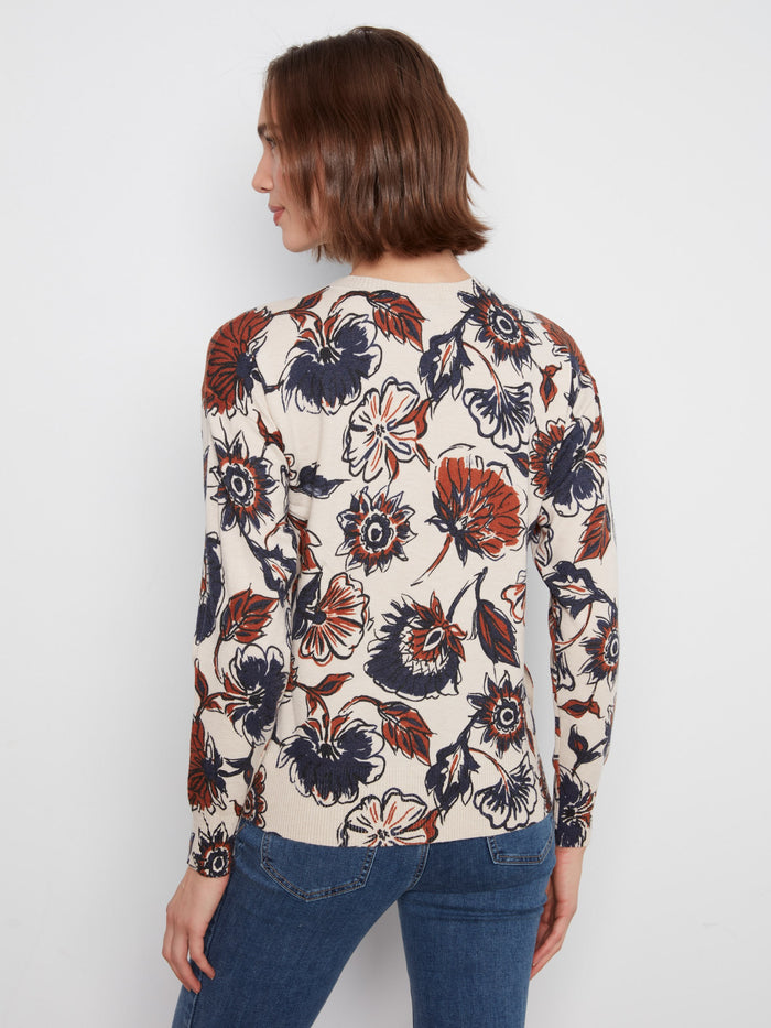 Side buttons enhance the overall appeal of this charming floral sweater, perfect for any casual occasion. By Charlie B.