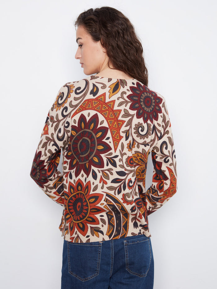 The vibrant floral print on this crew neck sweater brings life to any outfit, ensuring you stand out in style and comfort. By Charlie B.