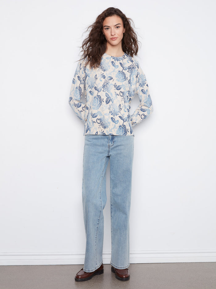 Chic floral blouse with drop shoulder design, offering relaxed elegance and comfort. Fashioned by Charlie B.